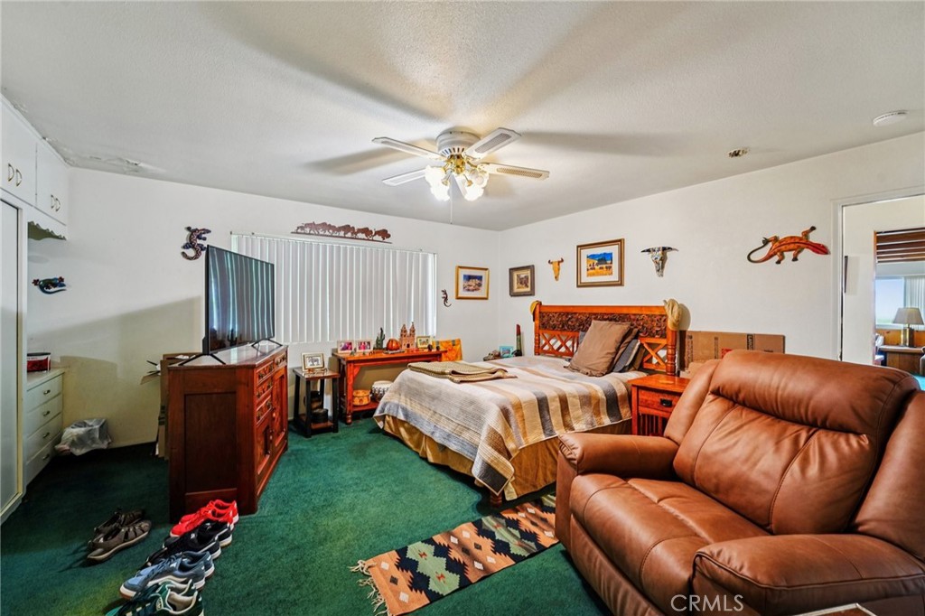 18947 Waseca Road Apple Valley, CA 92307 - Photo 13 of 34 a bedroom with bed and window