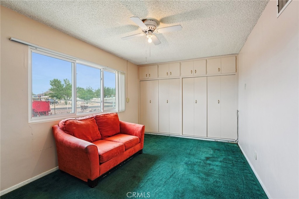 18947 Waseca Road Apple Valley, CA 92307 - Photo 15 of 34 a blue room with white walls and a large window