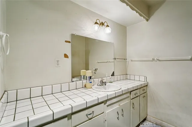 a bathroom with a sink and a mirror