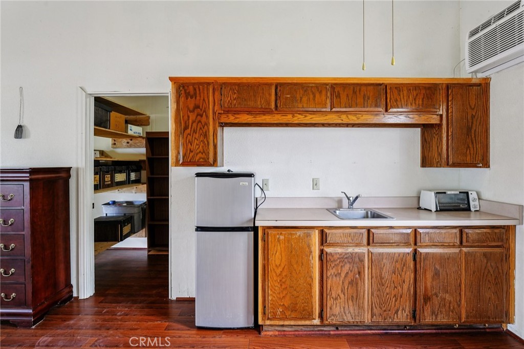 18947 Waseca Road Apple Valley, CA 92307 - Photo 20 of 34 a kitchen with stainless steel appliances granite countertop a refrigerator and a stove