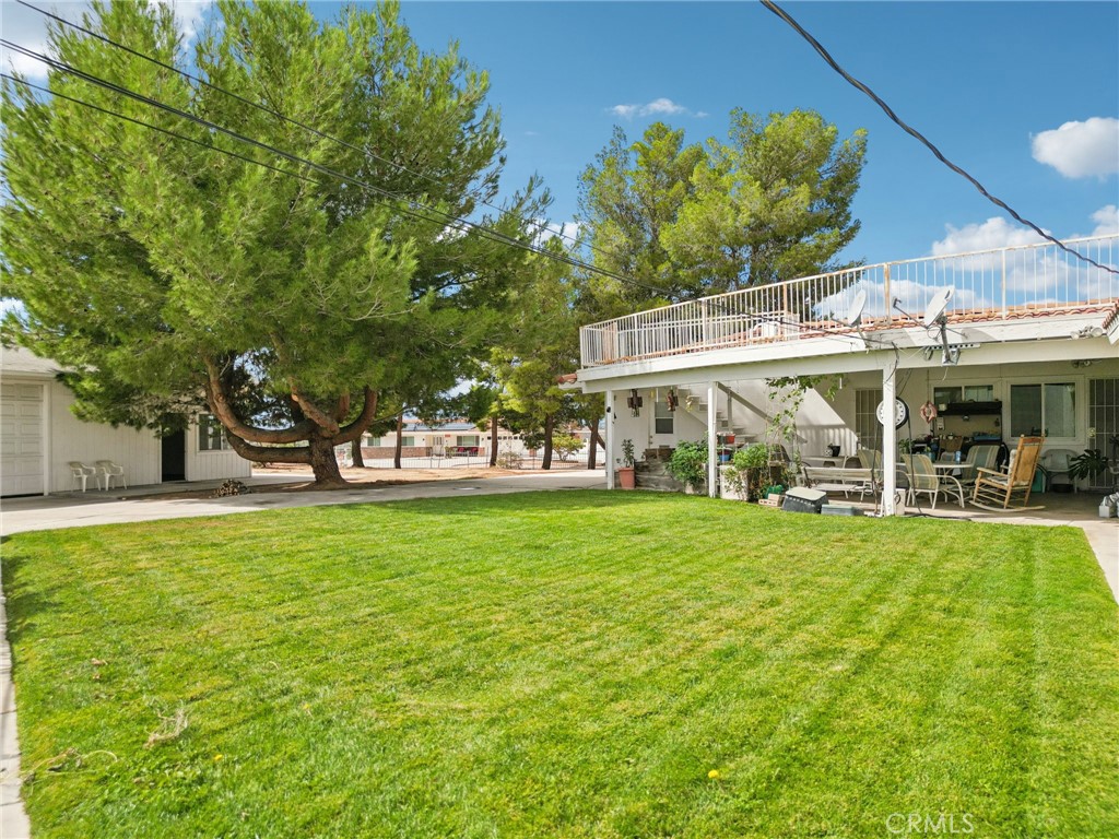 18947 Waseca Road Apple Valley, CA 92307 - Photo 25 of 34 a view of a house with a yard