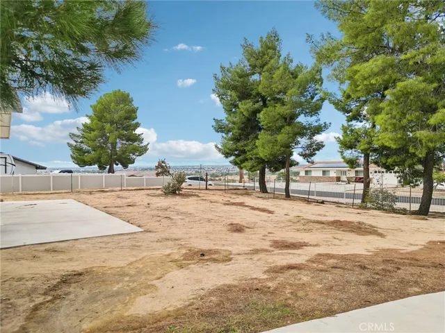 a view of a backyard of a house