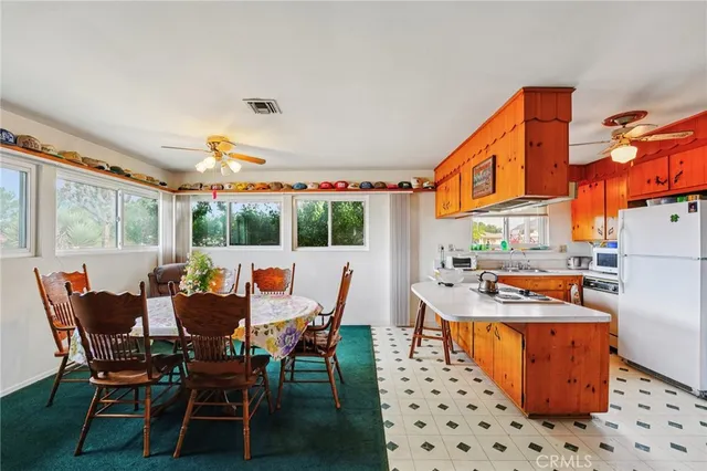 a dining room with a table and chairs