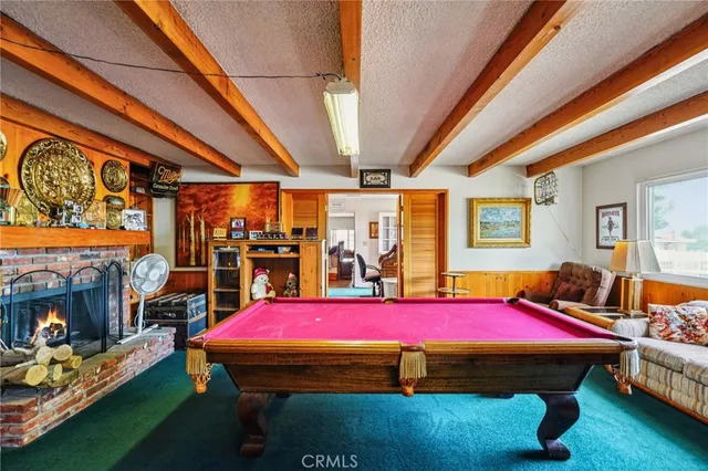 a room with pool table table and chairs