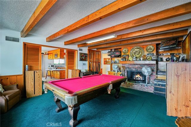 a room with pool table table tennis pool table and furniture