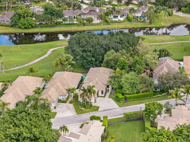an aerial view of a house with a lake view