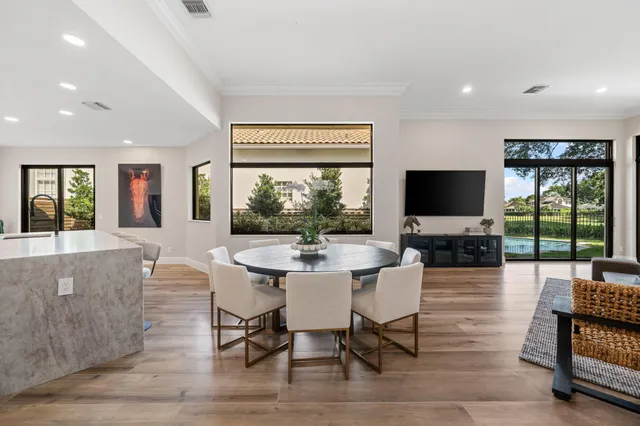 a view of a dining room with furniture window and outside view