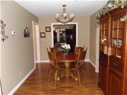 2156 River Road Clarksville, TN 37040 - Photo 5 of 17 a dining room with furniture a chandelier and wooden floor
