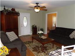 2156 River Road Clarksville, TN 37040 - Photo 8 of 17 a living room with furniture flowerpot and a chandelier