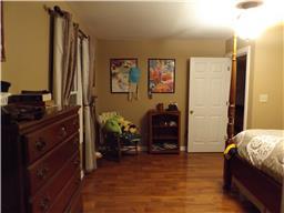 2156 River Road Clarksville, TN 37040 - Photo 10 of 17 a bedroom with a bed and a dresser