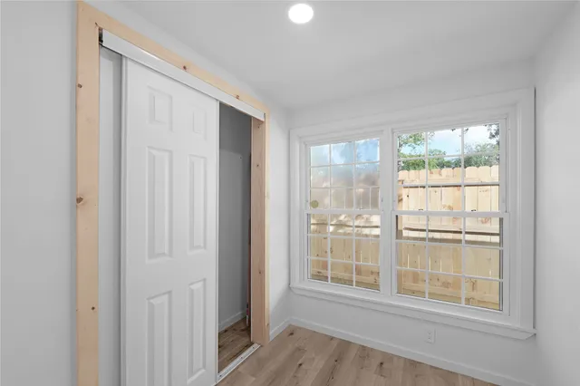 a bathroom with a double vanity sink mirror and shower