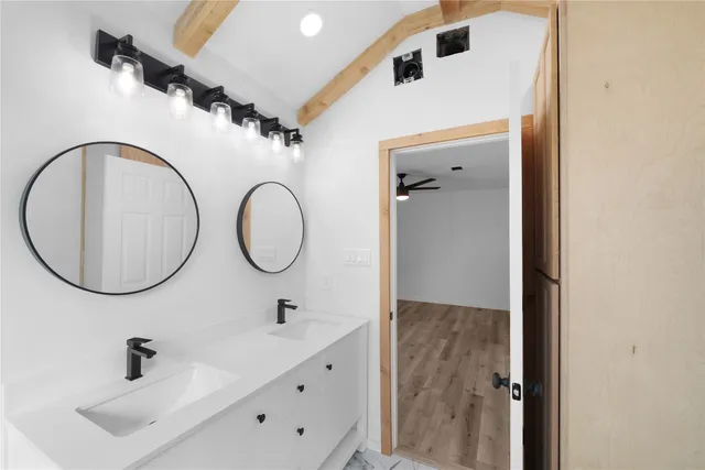 a bathroom with a sink and a mirror