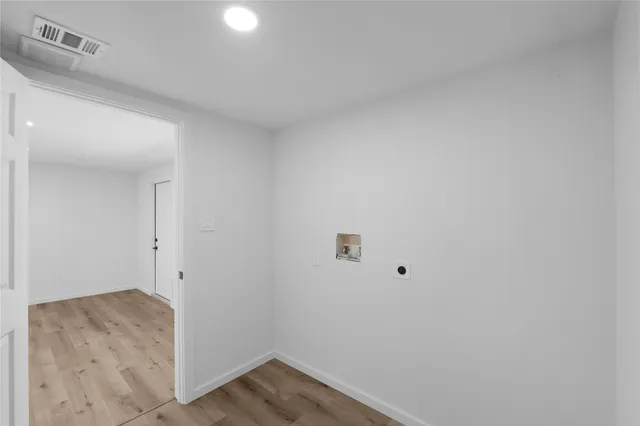 a view of house with backyard and garden