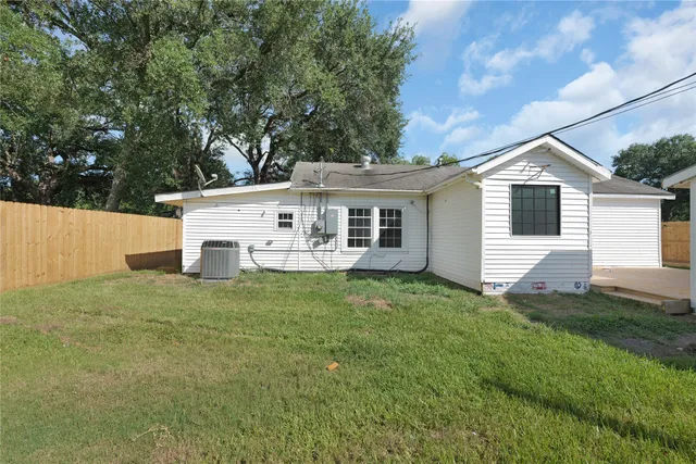 a view of a backyard of the house