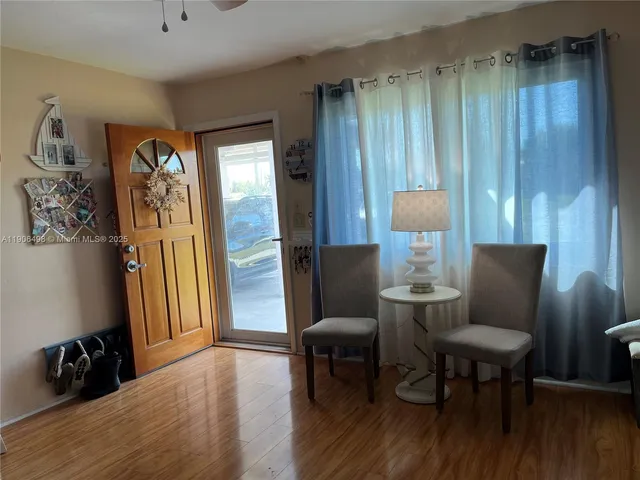 a view of a livingroom with furniture and a chair