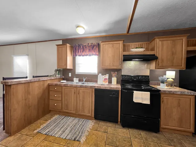 a kitchen with counter top space and appliances