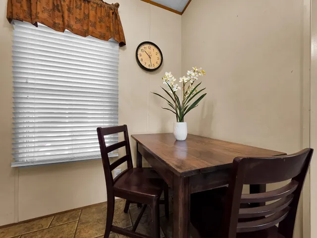 a kitchen with granite countertop cabinets a sink and appliances