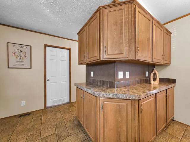 a bedroom with a bed and a night stand