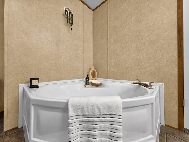 a bathroom with a shower and a mirror