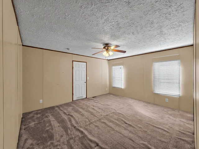a bathroom with a sink vanity granite tub and shower