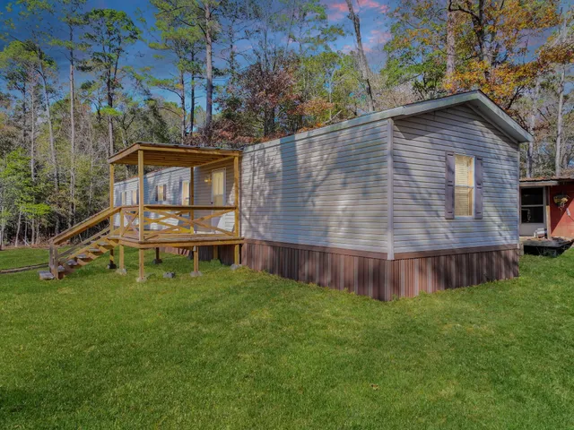 a view of a lake with a tree in the background