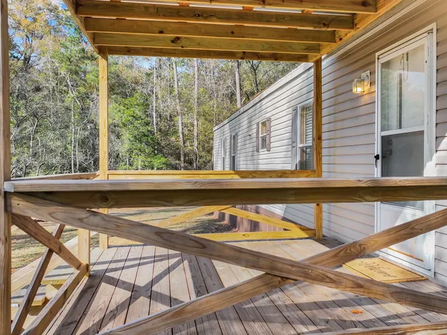 an aerial view of a houses with street