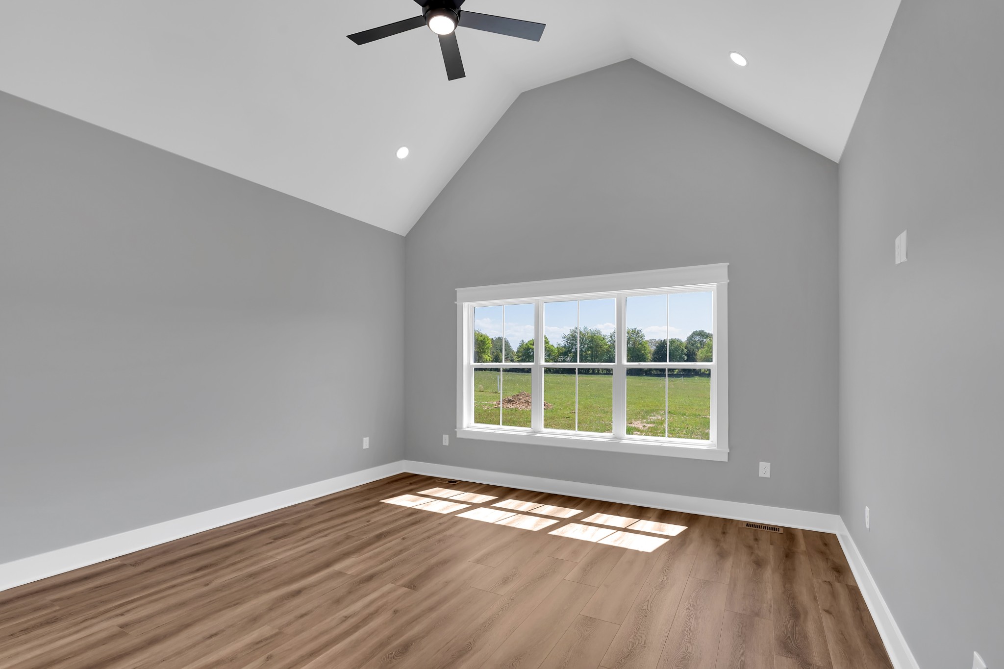 8246 Aedc Road Estill Springs, TN 37330 - Photo 26 of 55 an empty room with wooden floor and windows