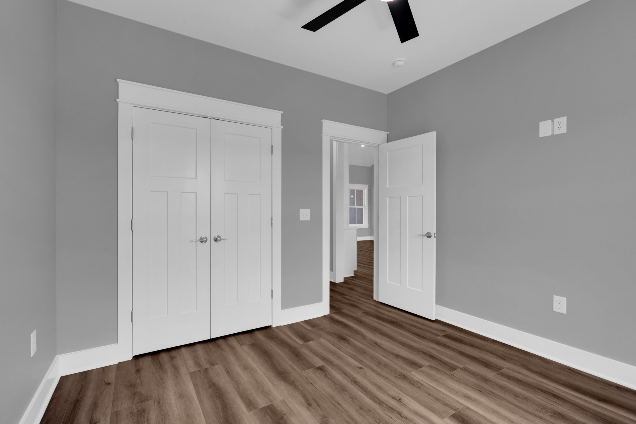 8246 Aedc Road Estill Springs, TN 37330 - Photo 42 of 55 a view of an empty room with wooden floor and windows