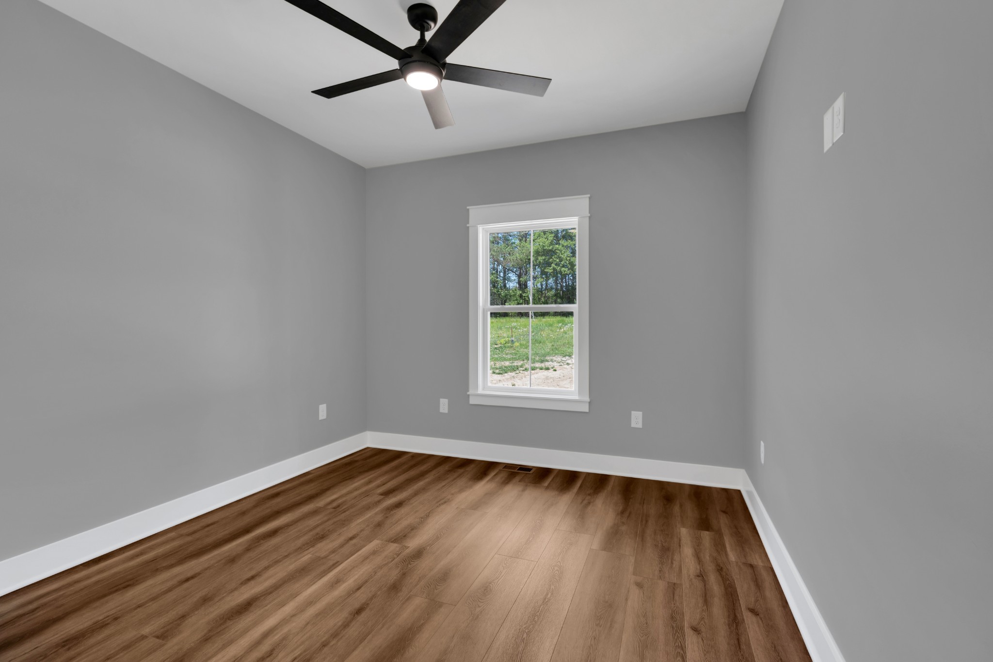 8246 Aedc Road Estill Springs, TN 37330 - Photo 44 of 55 wooden floor in an empty room with a window