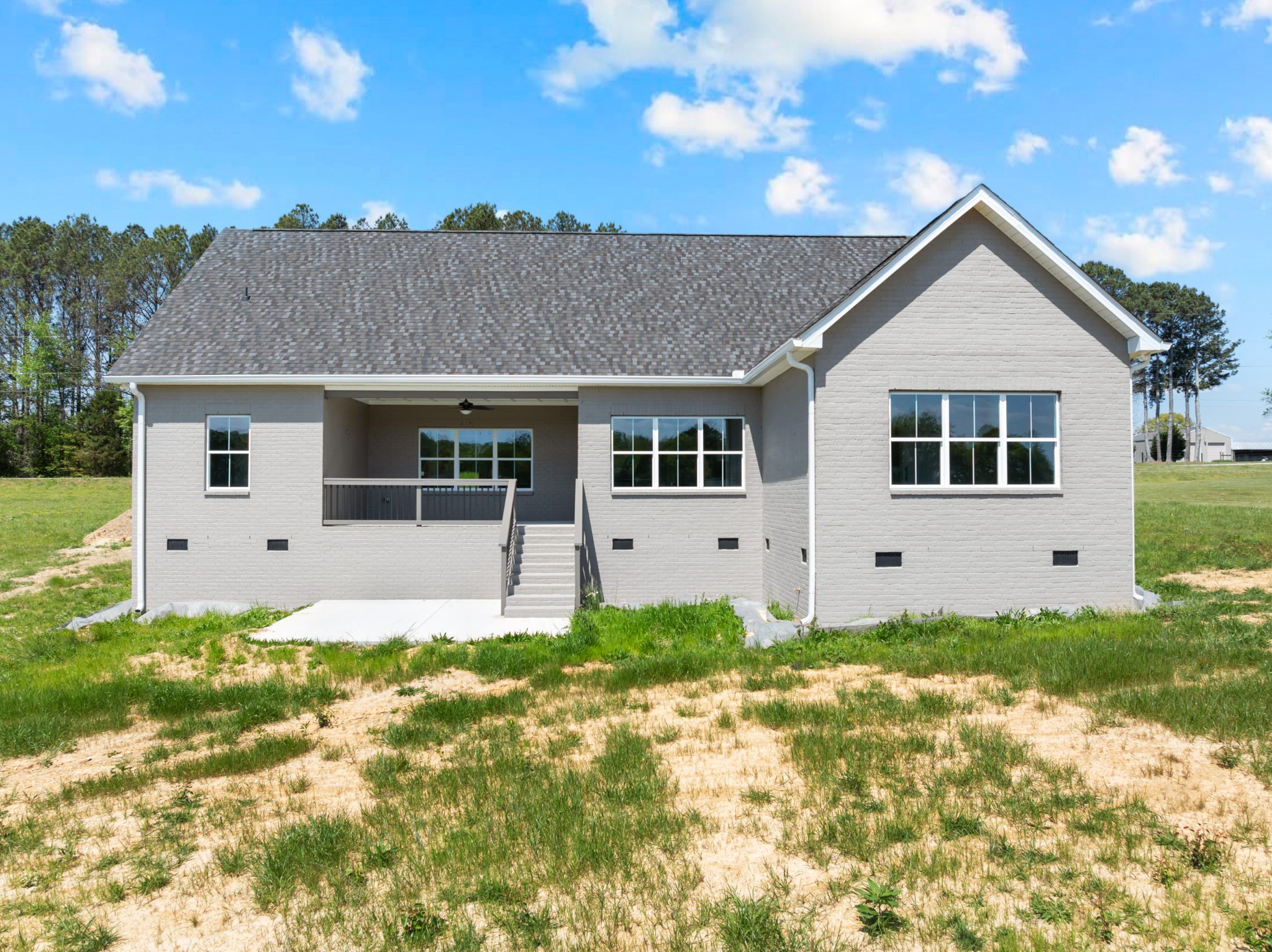 8246 Aedc Road Estill Springs, TN 37330 - Photo 5 of 55 a house with trees in the background