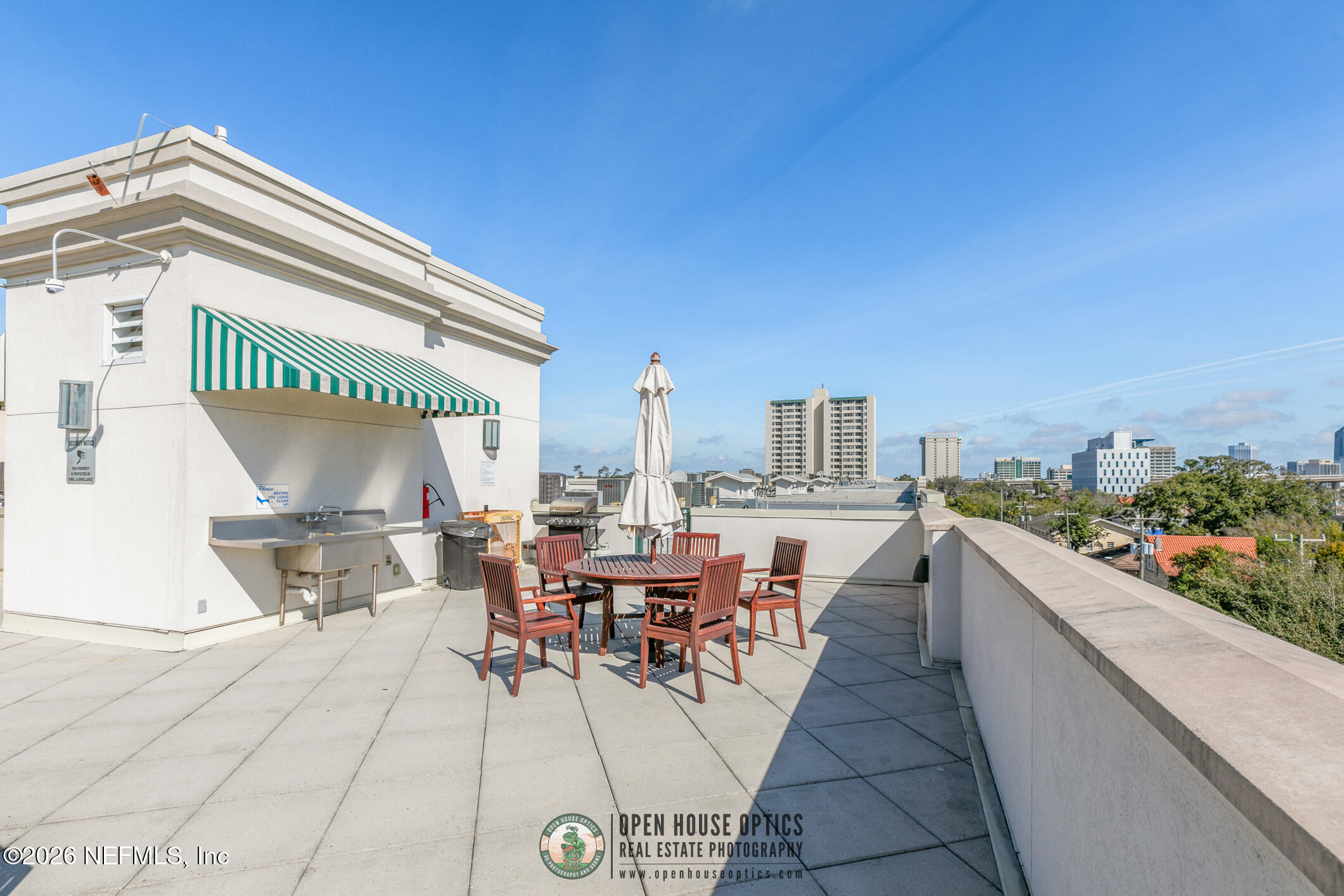 1661 Riverside Avenue, Unit 407 Jacksonville, FL 32204 - Photo 56 of 60 a view of a terrace with furniture and a potted plant