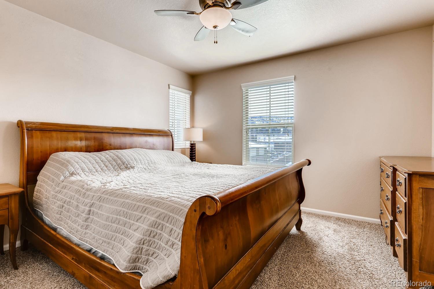 9520 Halstead Lane Lone Tree, CO 80124 - Photo 10 of 20 a bed sitting in a bedroom next to a window
