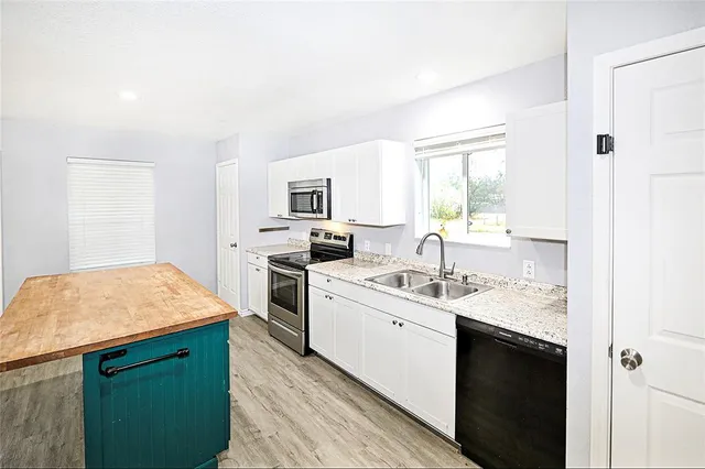 a view of an entryway with wooden floor