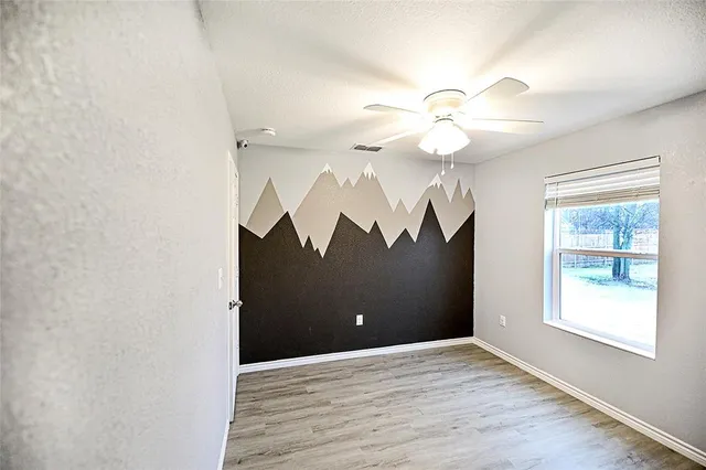 a white toilet sitting next to a bath tub