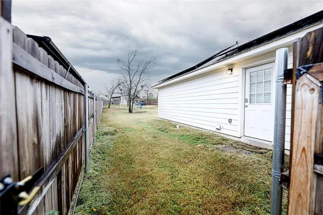 a view of backyard with trampoline