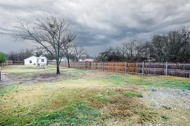 an aerial view of a house with a swimming pool