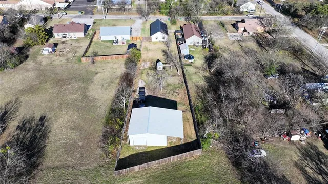 an aerial view of a house with swimming pool