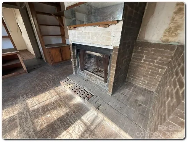 view of wooden floor and windows in a room