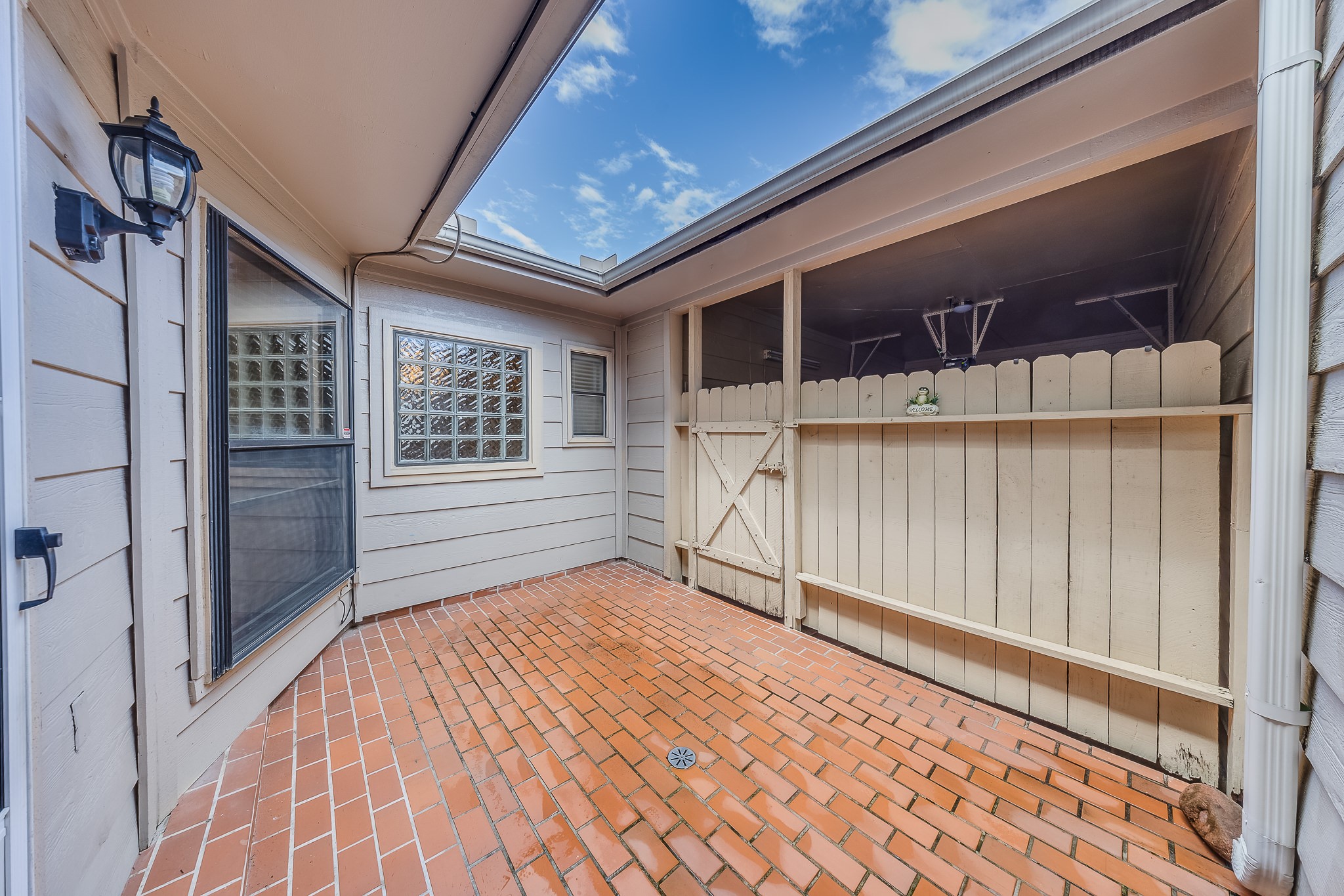 727 Bunker Hill Road, Unit 34 Houston, TX 77024 - Photo 31 of 38 The back patio is a great space to privately spend time outdoors and gain convenient access to both garages.
