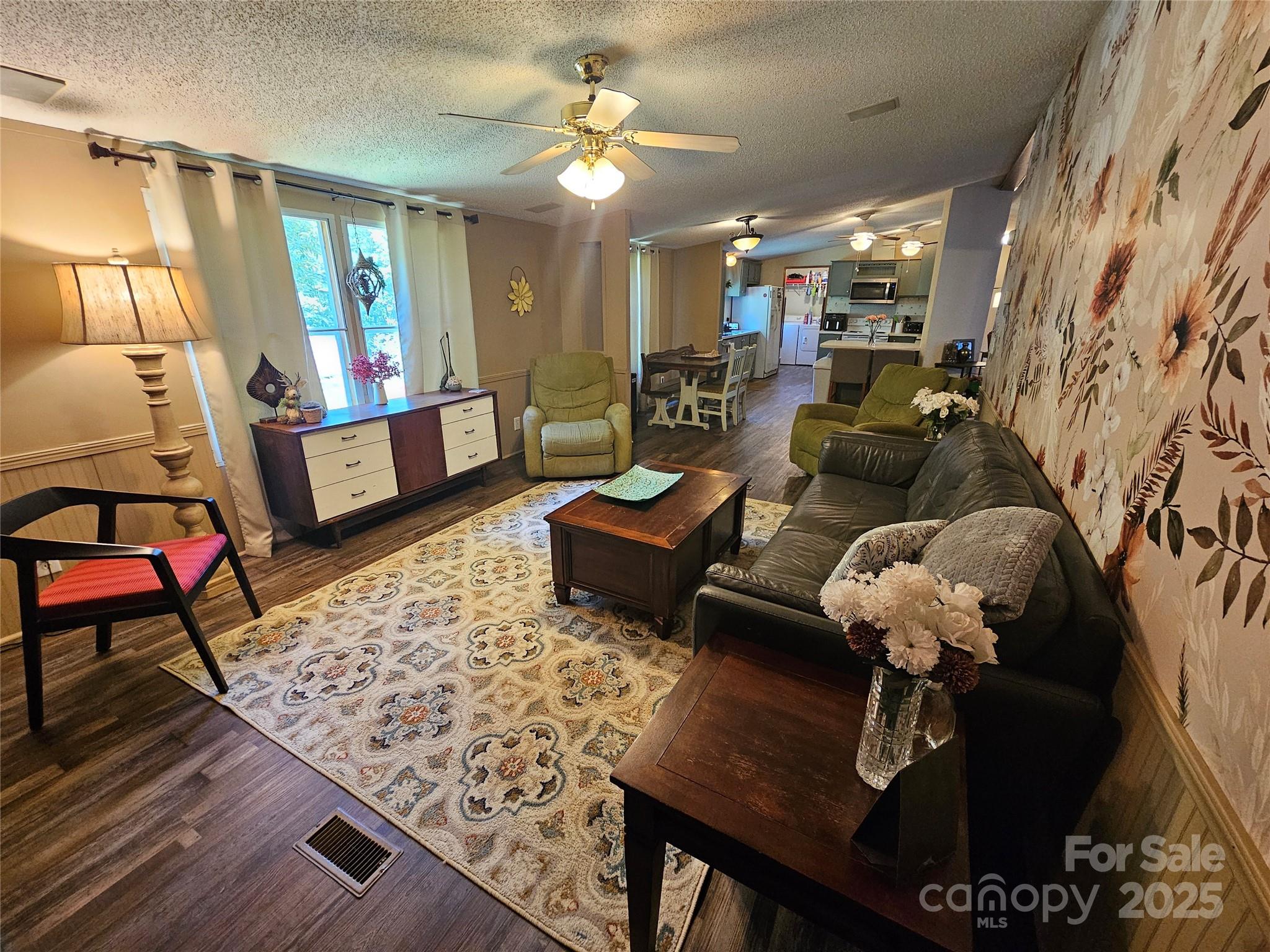 5062 Taylor Farm Road Lenoir, NC 28645 - Photo 14 of 25 a living room with furniture and wooden floor
