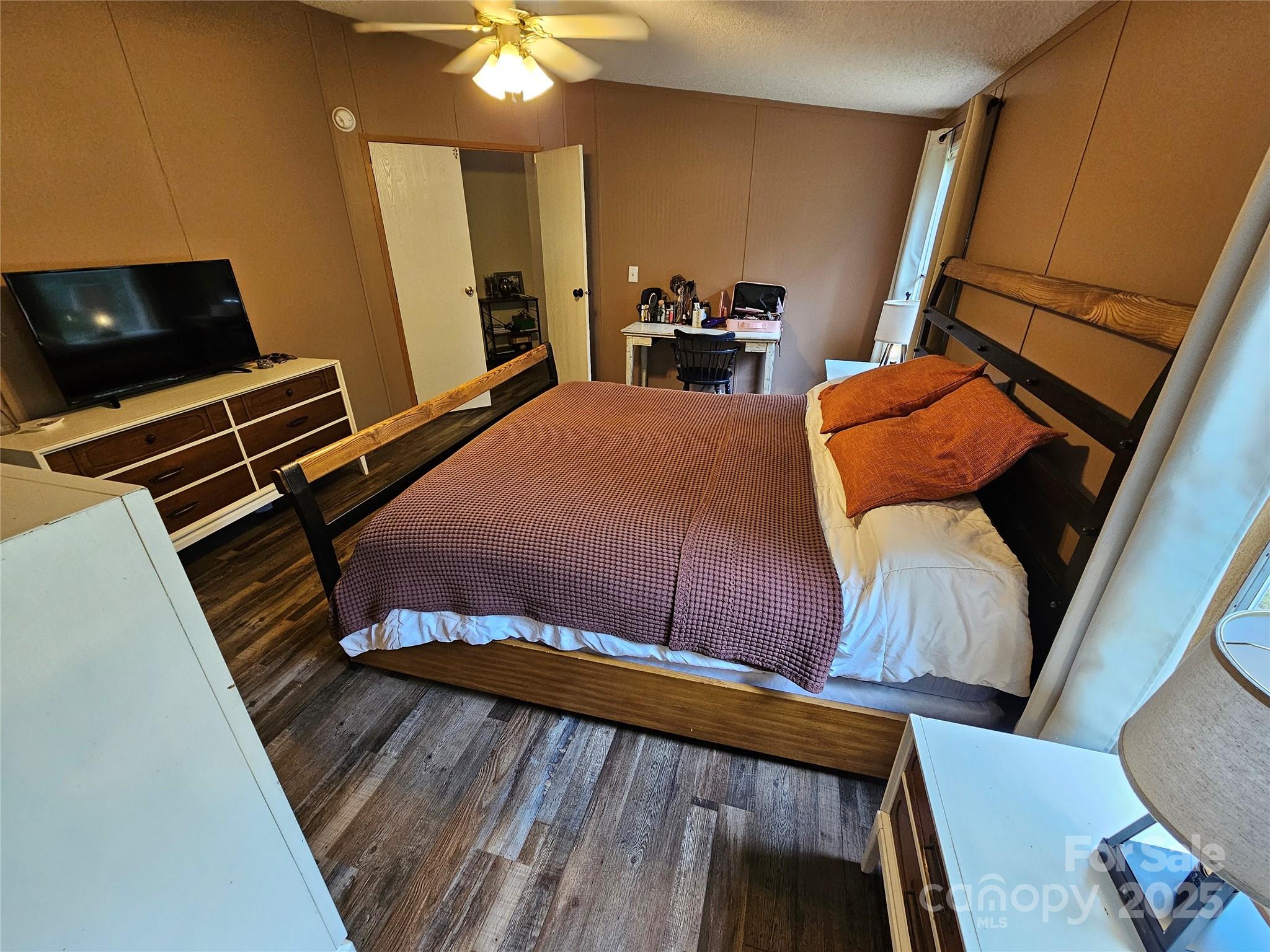 5062 Taylor Farm Road Lenoir, NC 28645 - Photo 18 of 25 a bedroom with furniture and wooden floor