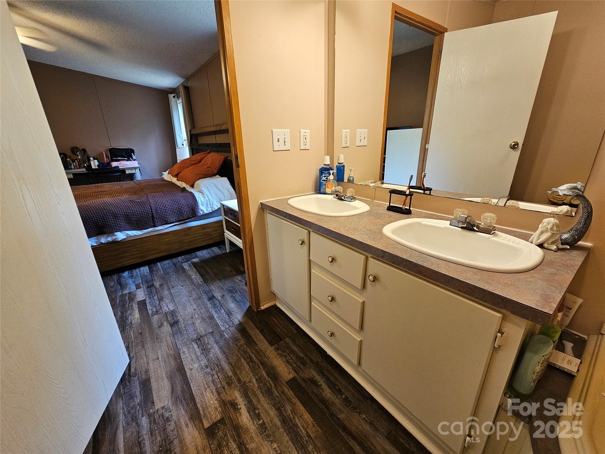 5062 Taylor Farm Road Lenoir, NC 28645 - Photo 19 of 25 a bathroom with a double vanity sink and mirror
