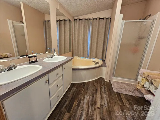 a bathroom with a double vanity sink and a mirror