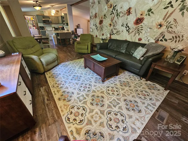 a living room with furniture and a rug