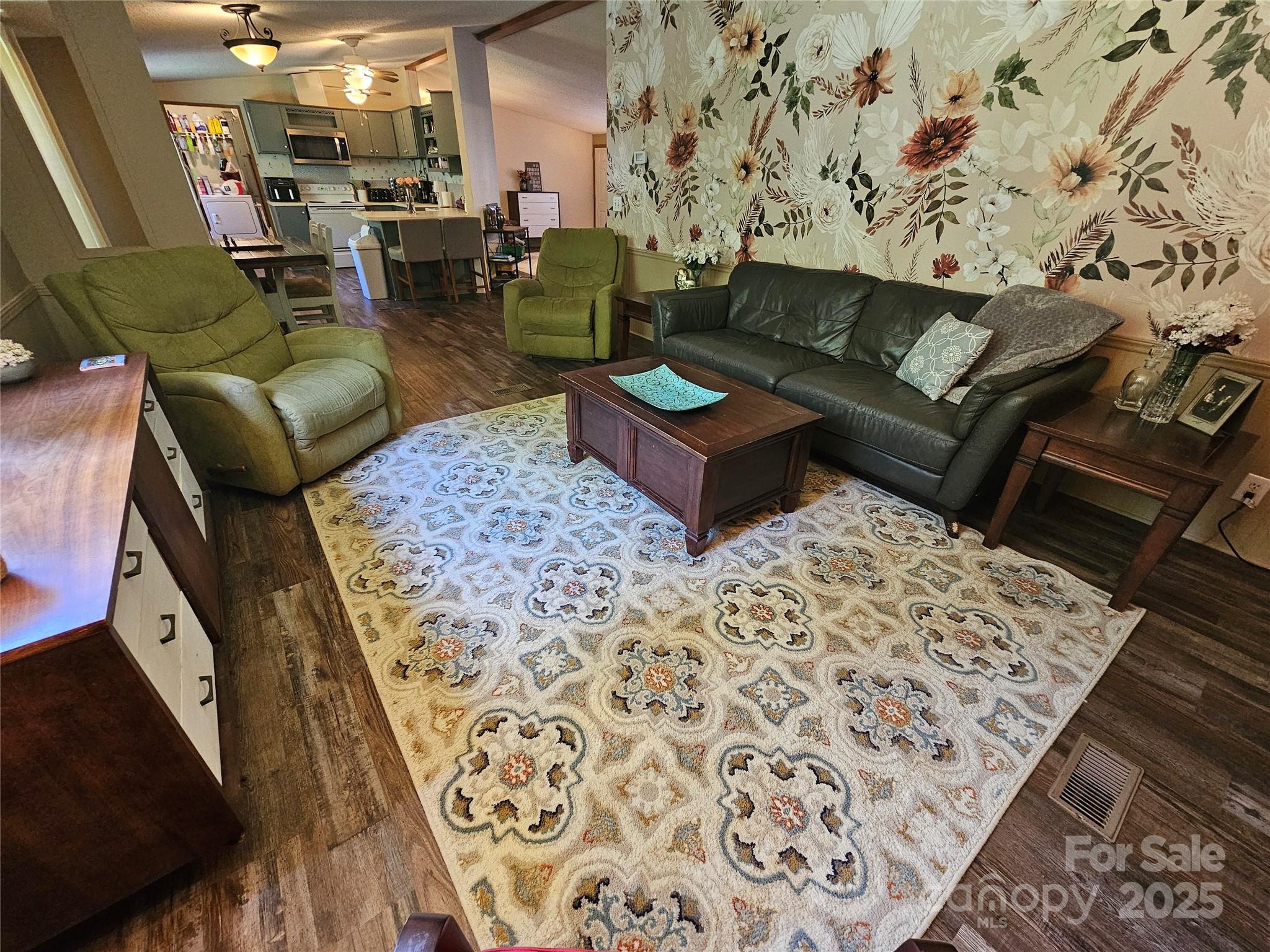 5062 Taylor Farm Road Lenoir, NC 28645 - Photo 10 of 25 a living room with furniture and a rug