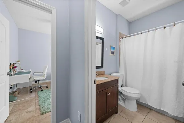 a bathroom with a toilet a sink and a shower