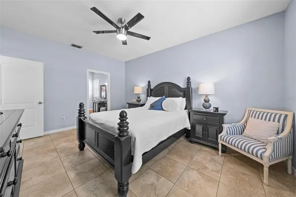 a bedroom with a bed and a couch