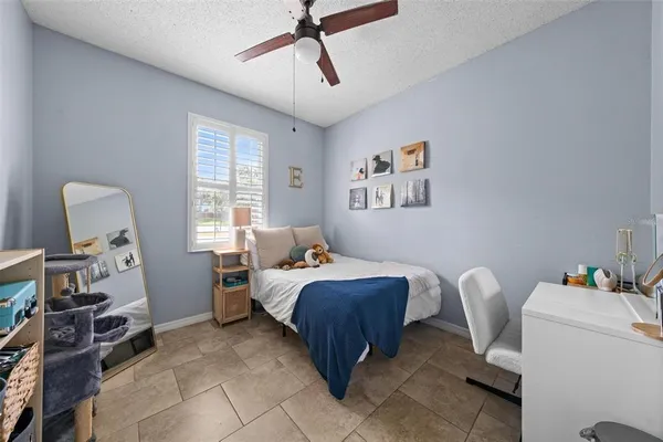 a bed room with bed and a window