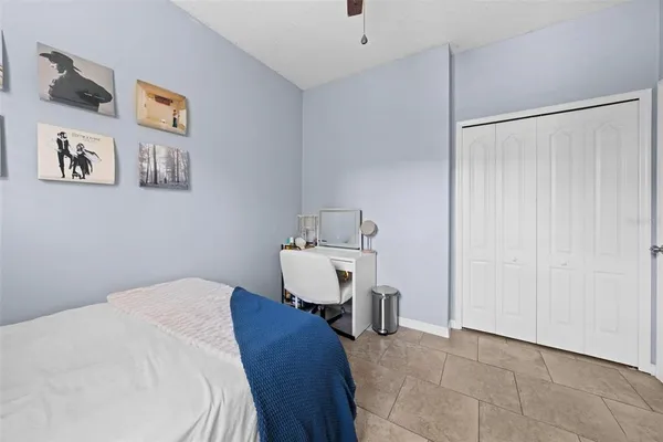 a bedroom with a bed and a table in it