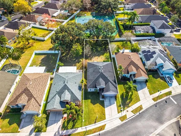an aerial view of residential houses with outdoor space